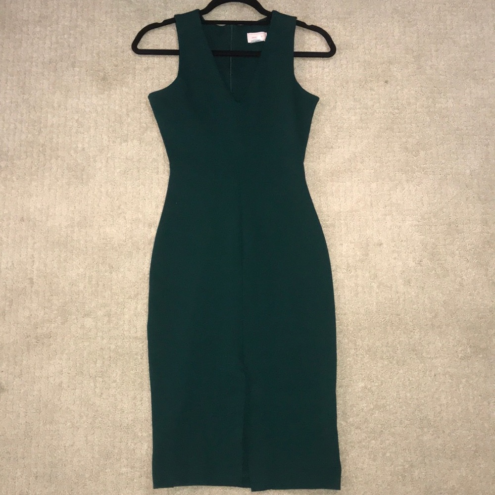Emerald green bodycon midi dress.